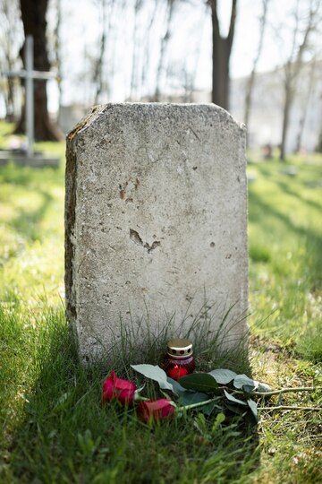 view-gravestone-with-flowers-candle_23-2149431309.jpg