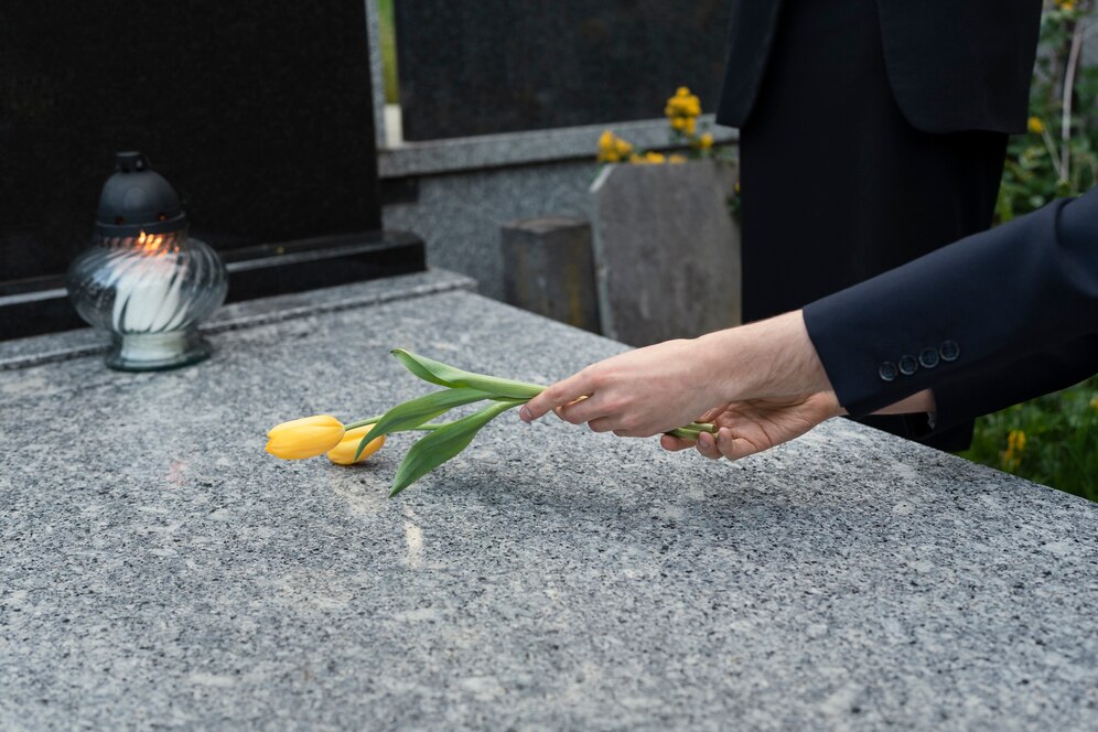 tulips-being-brought-grave-cemetery_23-2149435511.jpg